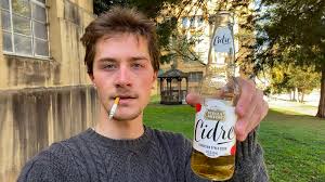 A Man daydrinking and enjoying a cigarete at 10am in the public park.